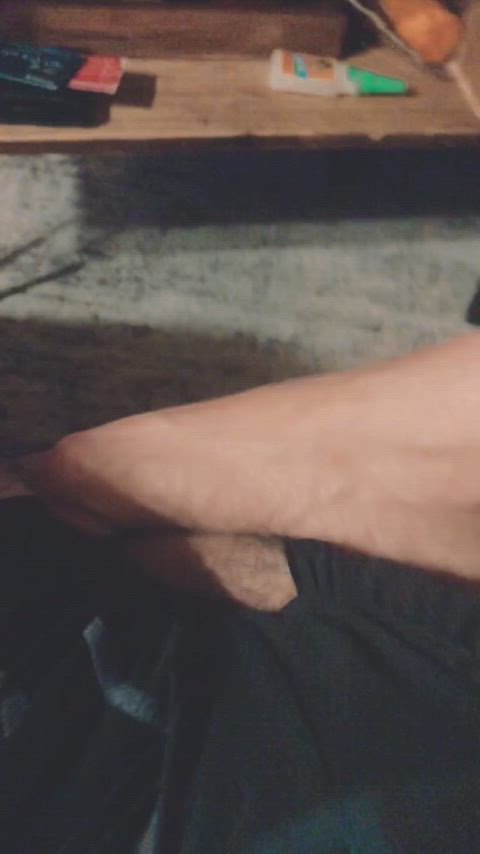 Pinning down his hung cock with her foot : video clip