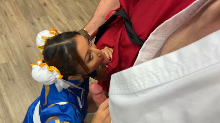On her knees fluffing us before the scene : video clip