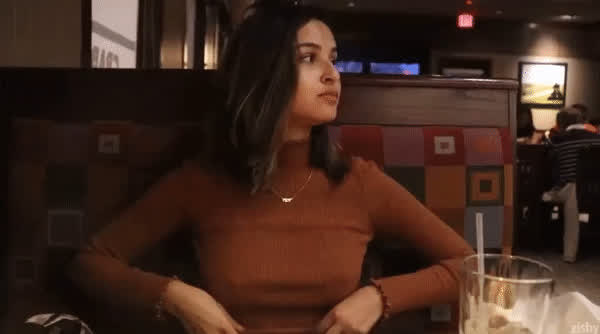 Beautiful girlfriend showing her perfect tits in a restaurant : video clip