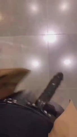 Straponed in a public toilet : video clip