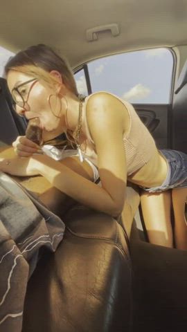 Breathtaking girl with glasses swallows a BBC in the backseat of car : video clip