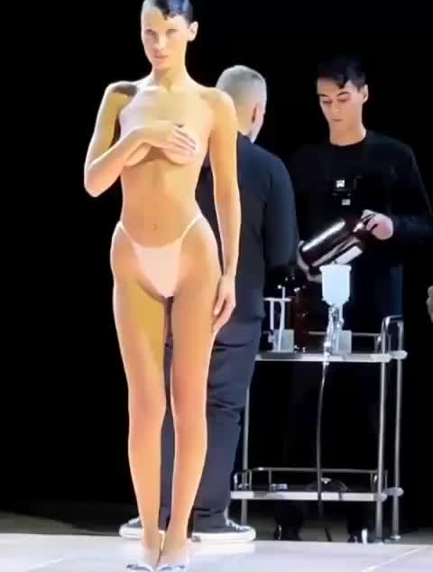 Bella Hadid Gets Dress Spray Painted on Half Nude Body at Runway : video clip
