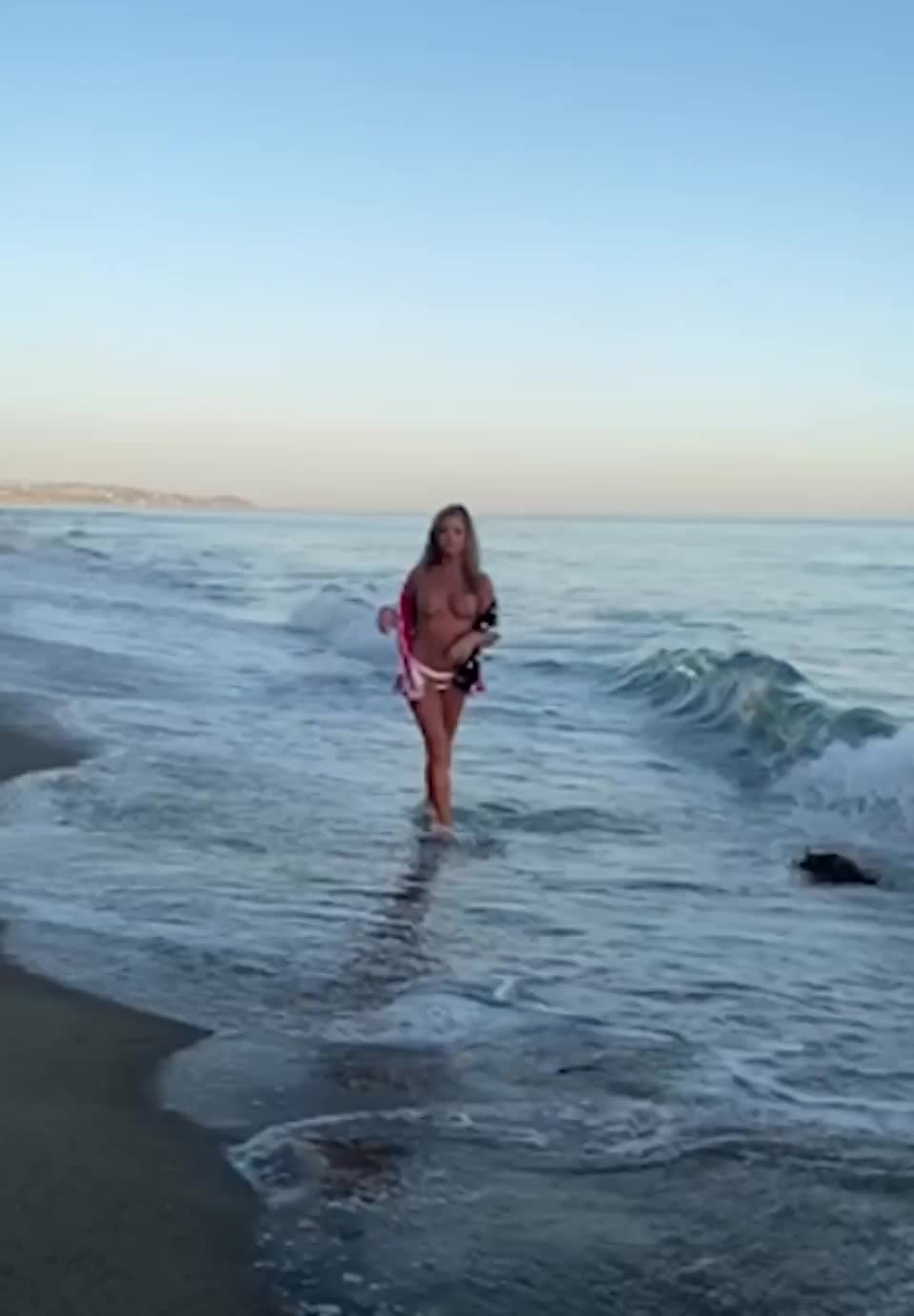 Denise Richards walking down a beach topless at 51 : video clip