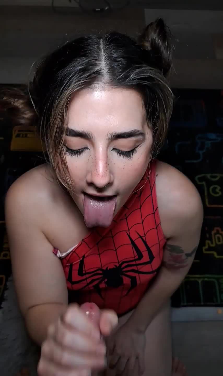 Spider girl getting sticky web on her face : video clip