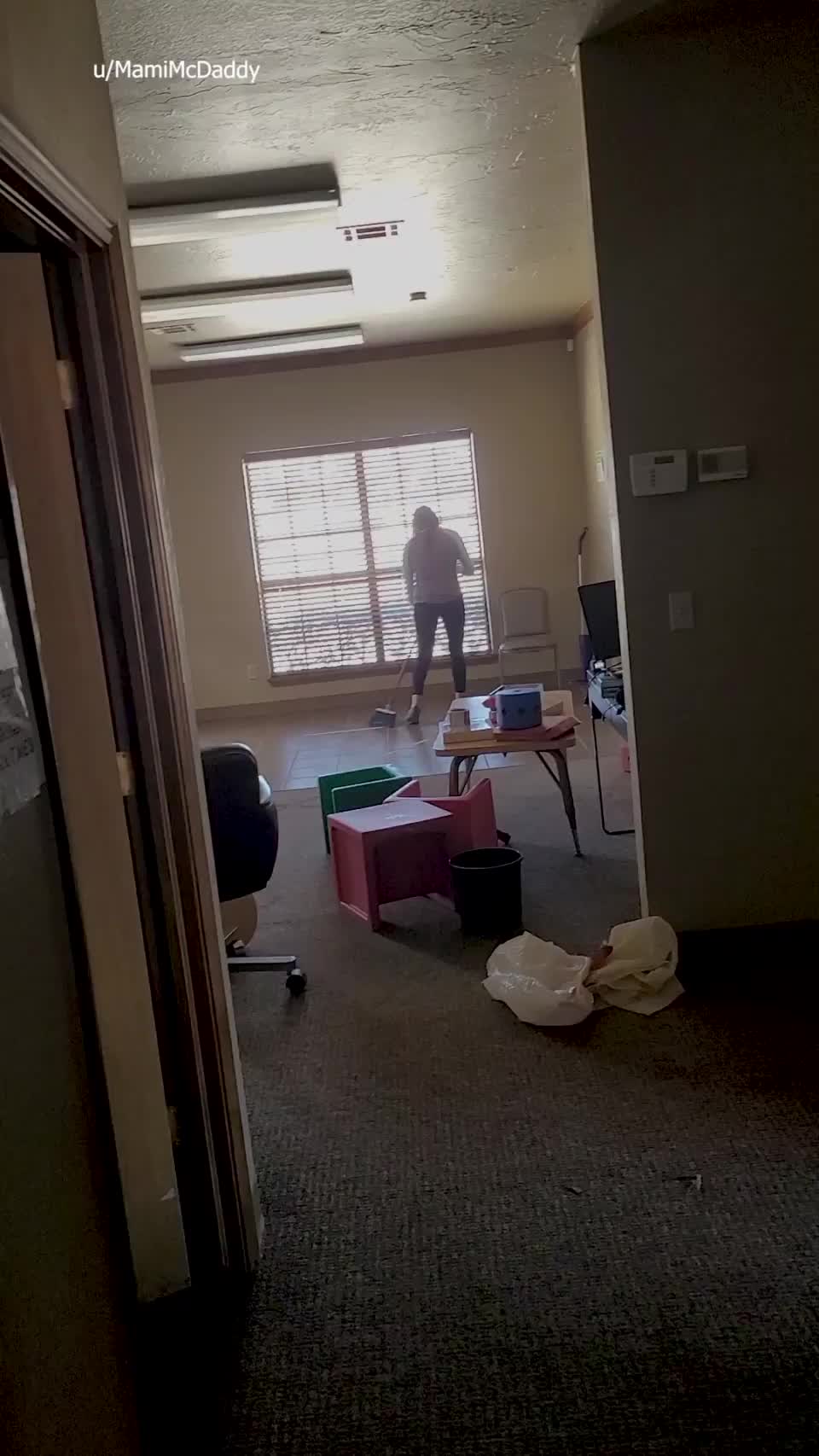 Spring cleaning interrupted in the office lobby : video clip