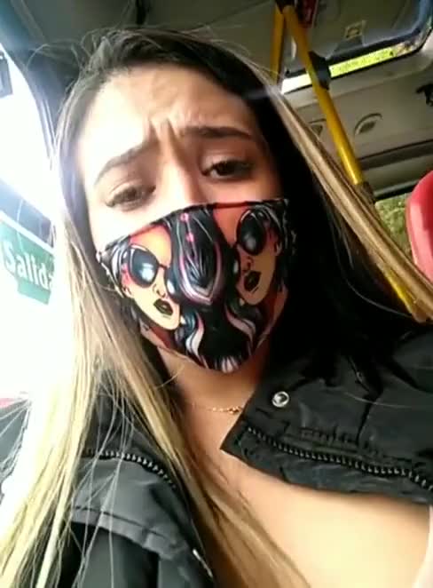 Squirting all over the bus seat, but at least she has her mask on! : video clip