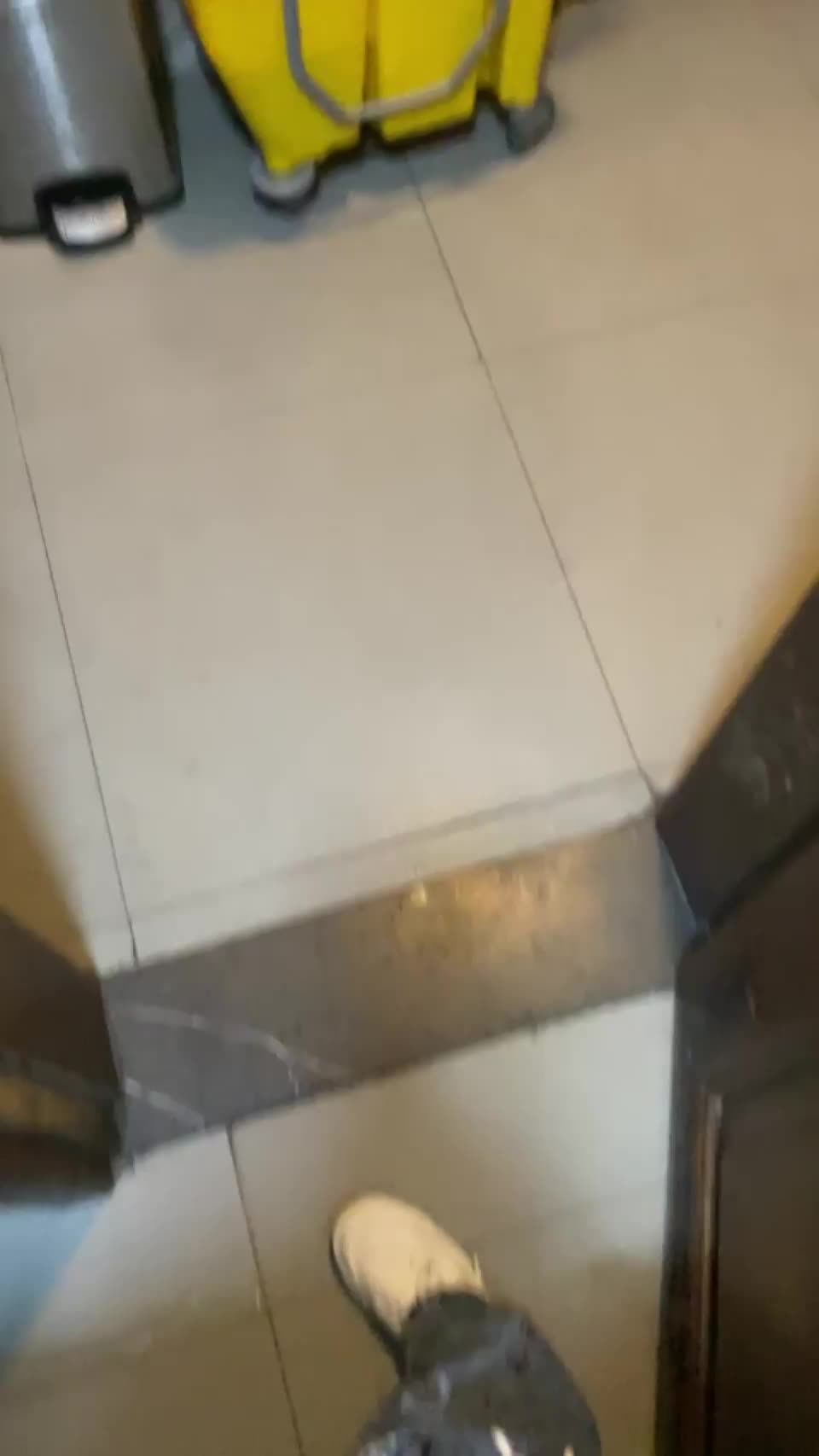 quick little flash with the door open before the guy in the bathroom next door comes out : video clip