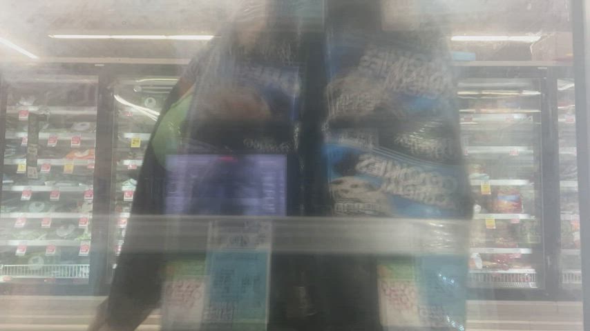 I was dared by a Redditor to put my phone inside the cooler in the frozen section, and rub my nipples up against the glass! [gif]