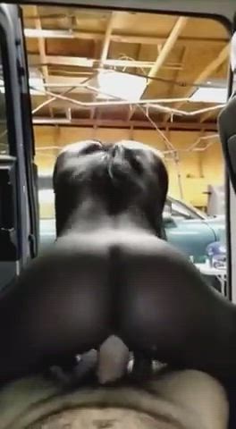 Ebony girl having fun in Automobile Garage : video clip