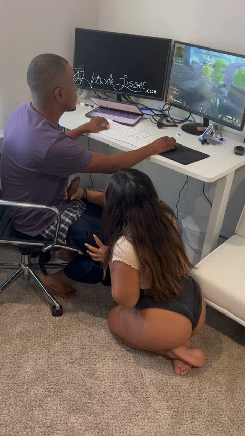 Stroking his big black cock while he plays his games : video clip