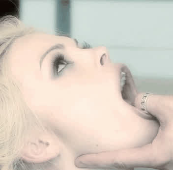 Holding her mouth open : video clip