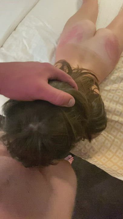 Adding another mark to her ass as she throats my cock while blindfolded : video clip
