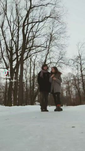 two horny girls are walking in the winter park : video clip