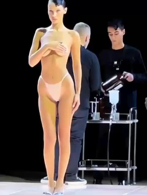 Bella Hadid Gets Dress Spray Painted on Half Nude Body at Runway : video clip