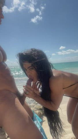 Liking the pre cum out on the beach : video clip