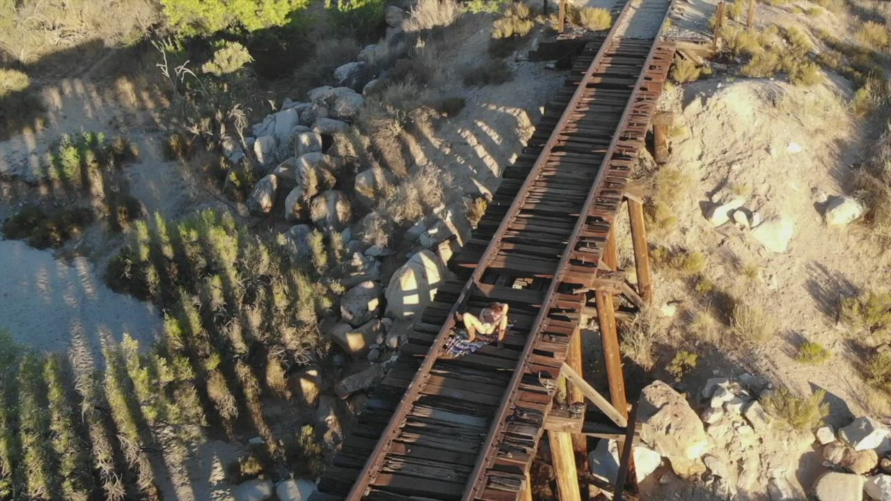 Wearing my plug and riding a dildo on some old train tracks. [gif] : video clip